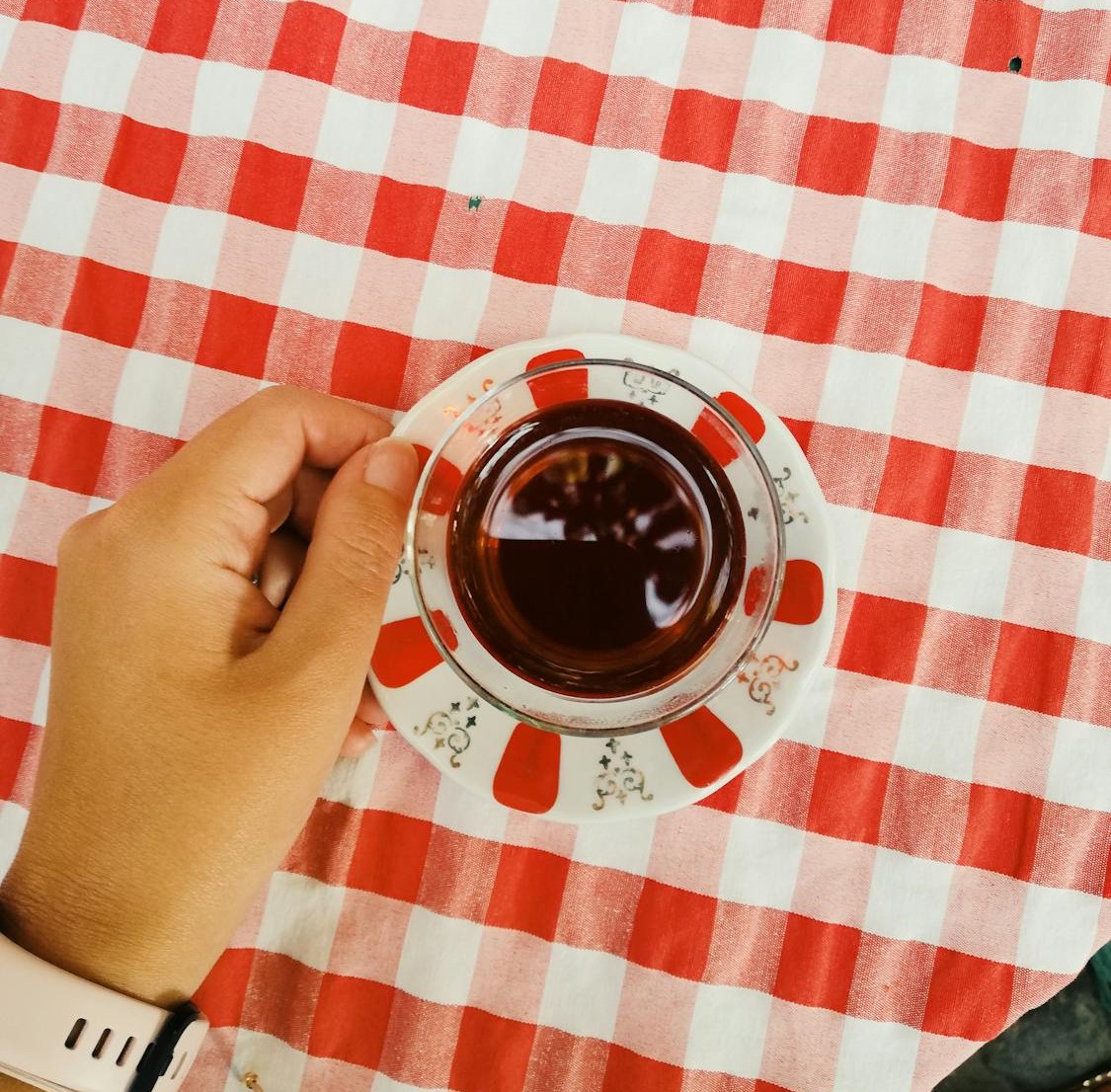 Clear mug with red patterned saucer
