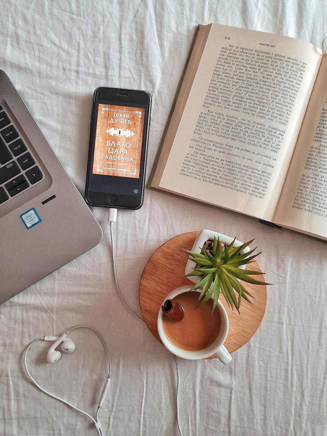 Coffee in bed with books and other items