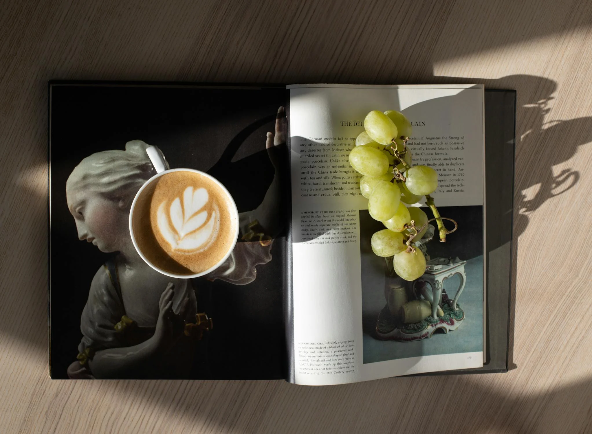 coffee and grapes on magazine